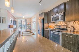 Photo 16: 103 Ascot Point SW in Calgary: Aspen Woods Row/Townhouse for sale : MLS®# A1183911
