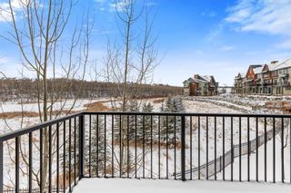Photo 13: 105 Ascot Manor SW in Calgary: Aspen Woods Row/Townhouse for sale : MLS®# A1185587