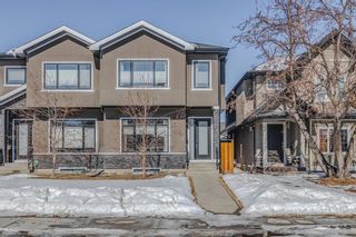 Main Photo: 238 23 Avenue NW in Calgary: Tuxedo Park Semi Detached (Half Duplex) for sale : MLS®# A2030831