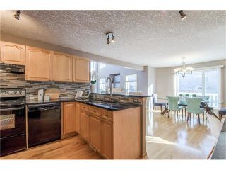Photo 12: 69 STRATHLEA Place SW in Calgary: Strathcona Park House for sale : MLS®# C4101174