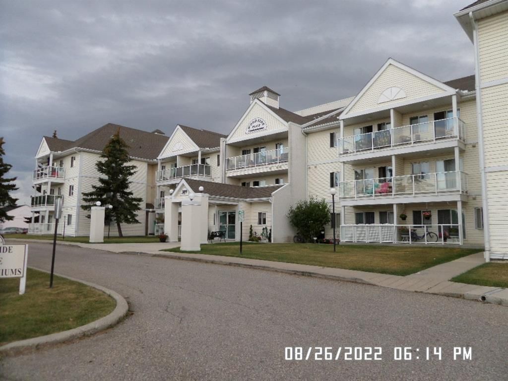 Main Photo: 310 309 Woodside Drive NW: Airdrie Apartment for sale : MLS®# A2050615