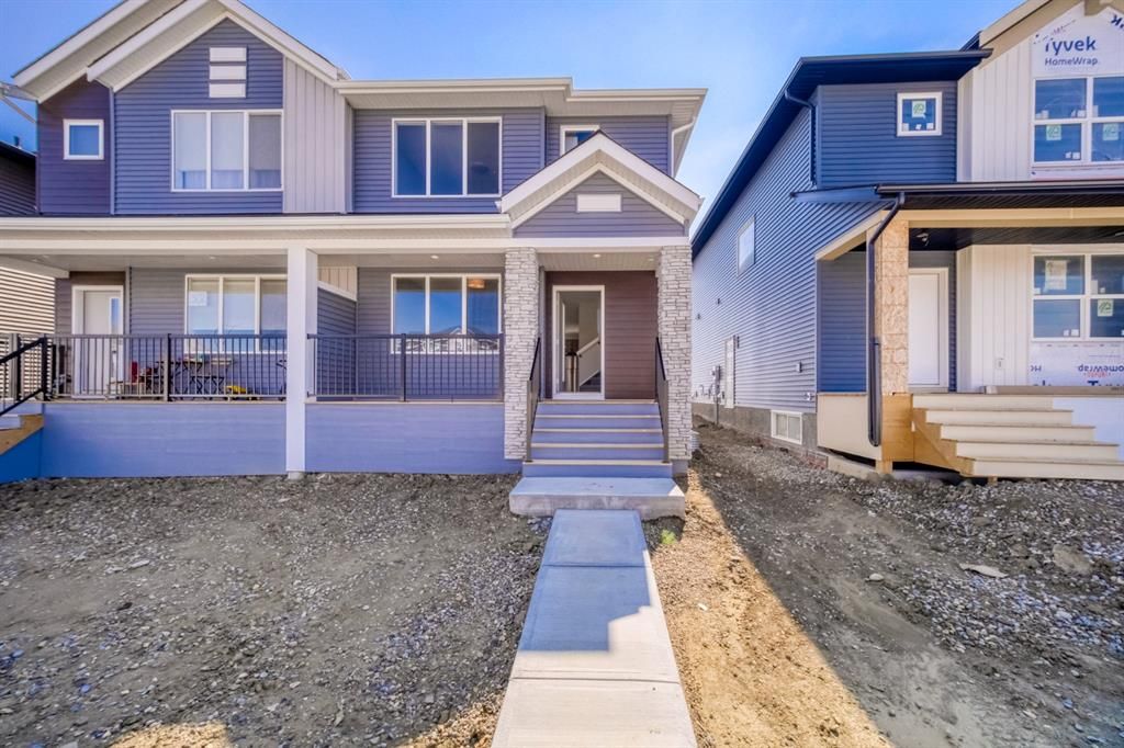 Main Photo: 306 Creekside Boulevard SW in Calgary: C-168 Semi Detached (Half Duplex) for sale : MLS®# A1254336