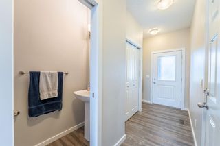 Photo 2: 5D Heritage Drive: Cochrane Row/Townhouse for sale : MLS®# A1220347