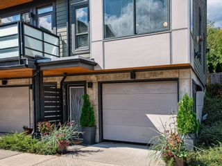 Photo 1: 38363 SUMMITS VIEW Drive in Squamish: Downtown SQ Townhouse for sale in "EAGLE WIND AT NATURES GATE" : MLS®# R2618293