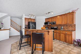 Photo 11: 28 Cougarstone Square SW in Calgary: Cougar Ridge Detached for sale : MLS®# A2036427