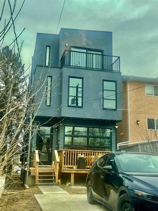 Main Photo: 2 114 28 Avenue NW in Calgary: Tuxedo Park Semi Detached (Half Duplex) for sale : MLS®# A2124859