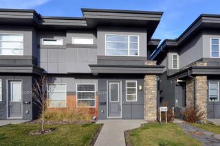 Photo 1: 2018 35 Avenue SW in Calgary: Altadore Row/Townhouse for sale : MLS®# A2093292