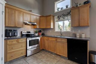 Photo 10: 48 Crystal Shores Cove: Okotoks Row/Townhouse for sale : MLS®# A2123368