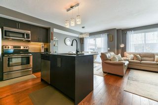 Photo 12: 11 West Coach Manor SW in Calgary: West Springs Row/Townhouse for sale : MLS®# A2035861
