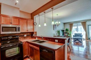Photo 5: 4 156 Rockyledge View NW in Calgary: Rocky Ridge Row/Townhouse for sale : MLS®# A2120202