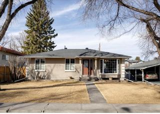 Photo 1: 2040 56 Avenue SW in Calgary: North Glenmore Park Detached for sale : MLS®# A2058604