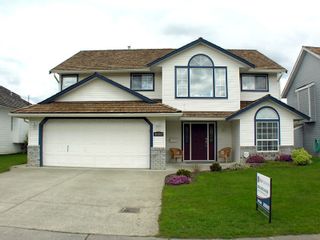 Photo 1: 35453 LETHBRIDGE Drive in Abbotsford: Abbotsford East House for sale in "Sandy Hill" : MLS®# F1110467