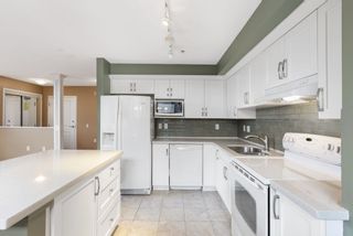 Photo 4: 222 8880 202 Street in Langley: Walnut Grove Condo for sale in "THE RESIDENCES AT VILLAGE SQUARE" : MLS®# R2724268