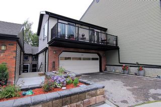 Photo 1: 14 448 Strathcona Drive SW in Calgary: Strathcona Park Row/Townhouse for sale : MLS®# A1221433