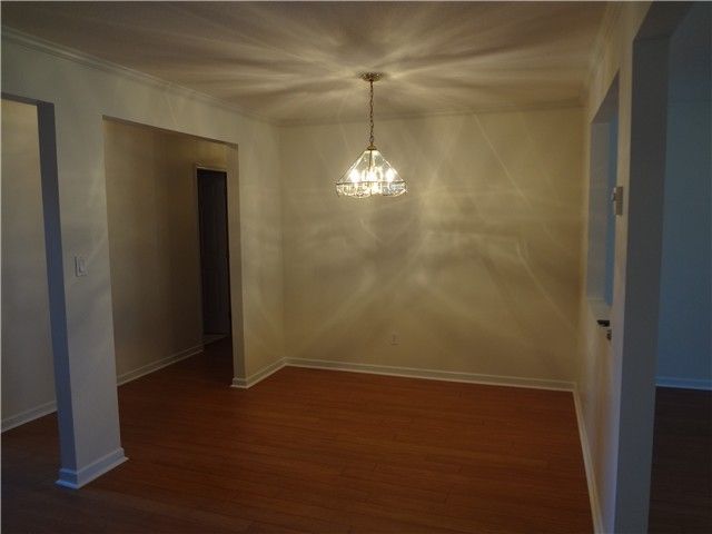 Dining Room: New laminate flooring in this 14' long dining room. Bring on the quests.