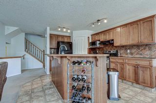 Photo 15: 28 Cougarstone Square SW in Calgary: Cougar Ridge Detached for sale : MLS®# A1099416