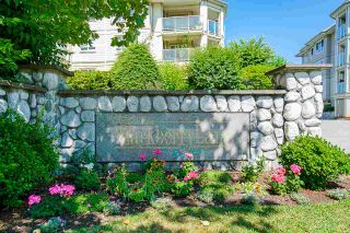 Photo 1: 104 20125 55A Avenue in Langley: Langley City Condo for sale in "Blackberry II" : MLS®# R2484759