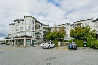 Photo 1: 412 5759 GLOVER Road in Langley: Langley City Condo for sale in "College Court" : MLS®# R2301267