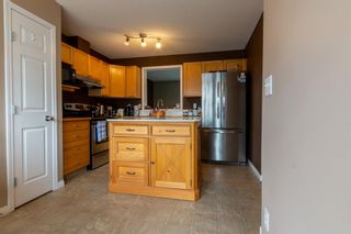 Photo 2: 113 Everhollow Heights SW in Calgary: Evergreen Row/Townhouse for sale : MLS®# A1215012