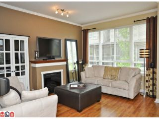 Photo 2: 50 16789 60TH Avenue in Surrey: Cloverdale BC Townhouse for sale in "Laredo" (Cloverdale)  : MLS®# F1014213
