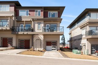 Photo 2: 104 501 River Heights Drive: Cochrane Row/Townhouse for sale : MLS®# A1204085