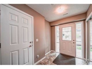 Photo 3: 113 WINDSTONE Mews SW: Airdrie House for sale : MLS®# C4016126