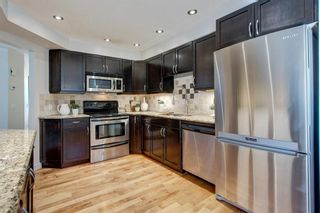 Photo 9: 212 Coachway Lane SW in Calgary: Coach Hill Row/Townhouse for sale : MLS®# A1153091