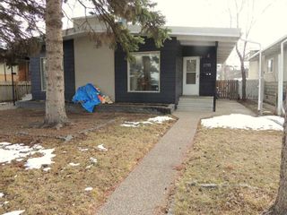 Photo 1: 2715 Canmore Road NW in Calgary: Banff Trail Semi Detached (Half Duplex) for sale : MLS®# A2120851