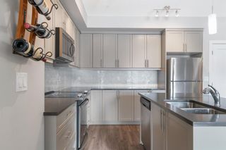 Photo 4: 104 300 Auburn Meadows Manor SE in Calgary: Auburn Bay Apartment for sale : MLS®# A2022411