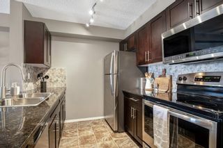 Photo 3: 8314 403 Mackenzie Way SW: Airdrie Apartment for sale : MLS®# A1258232