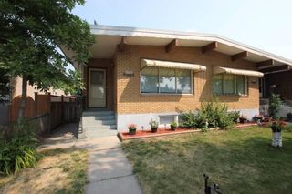 Photo 1: 402 18 Avenue NW in Calgary: Mount Pleasant Full Duplex for sale : MLS®# A2011602