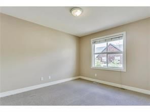 Photo 12: 183 Bridlewood View SW in Calgary: Bridlewood Row/Townhouse for sale : MLS®# A2014089