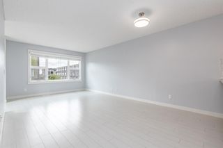 Photo 5: 404 Covecreek Circle NE in Calgary: Coventry Hills Row/Townhouse for sale : MLS®# A1217696