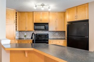 Photo 8: 205 Springbank Terrace SW in Calgary: Springbank Hill Semi Detached for sale : MLS®# A1182683