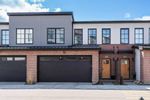 Main Photo: 215 7820 Spring Willow Drive SW in Calgary: Springbank Hill Row/Townhouse for sale : MLS®# A2126081