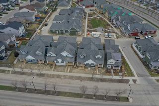 Main Photo: 21 Drake Landing Square: Okotoks Semi Detached (Half Duplex) for sale : MLS®# A2128719