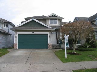 Photo 1: 6238 167A ST in Surrey: Cloverdale BC House for sale in "CLOVER RIDGE" (Cloverdale)  : MLS®# F1300016