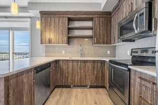 Photo 3: 412 6703 New Brighton Avenue SE in Calgary: New Brighton Apartment for sale : MLS®# A2102523