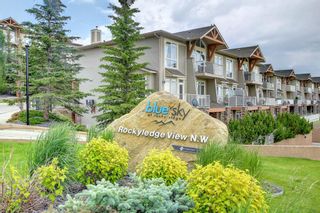 Photo 2: 1 108 Rockyledge View NW in Calgary: Rocky Ridge Row/Townhouse for sale : MLS®# A1234759