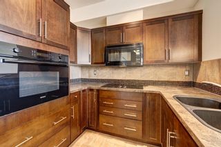 Photo 12: 415 26 Val Gardena View SW in Calgary: Springbank Hill Apartment for sale : MLS®# A1257390