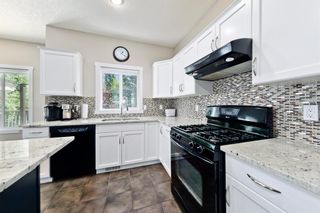 Photo 7: 125 COUGARSTONE Manor SW in Calgary: Cougar Ridge Detached for sale : MLS®# A1019561