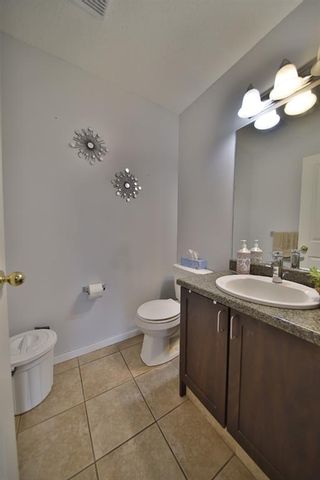 Photo 14: 10 388 Sandarac Drive NW in Calgary: Sandstone Valley Row/Townhouse for sale : MLS®# A1181075