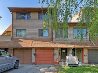 Main Photo: 111 Woodvale Bay SW in Calgary: Woodlands Row/Townhouse for sale : MLS®# A2136253