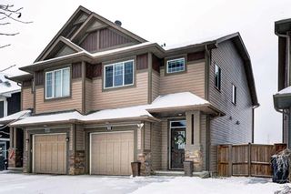Photo 1: 123 Auburn Meadows Place SE in Calgary: Auburn Bay Semi Detached (Half Duplex) for sale : MLS®# A2106833