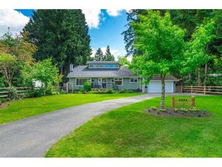 Photo 1: 3886 204A STREET in Langley: Brookswood Langley House for sale : MLS®# R2591670