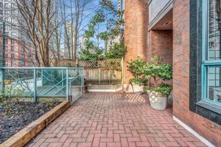 Photo 1: 104 293 SMITHE Street in Vancouver: Downtown VW Townhouse for sale in "Rosedale Gardens" (Vancouver West)  : MLS®# R2866224