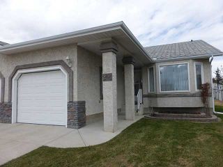 Photo 1: 205 ARBOUR CLIFF Close NW in CALGARY: Arbour Lake Residential Attached for sale (Calgary)  : MLS®# C3614284