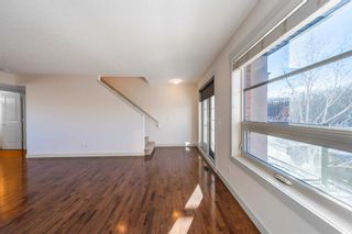 Photo 12: 1574 93 Street SW in Calgary: Aspen Woods Row/Townhouse for sale : MLS®# A2101400