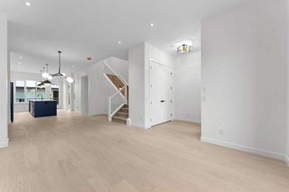 Photo 5: 221 27 Avenue NW in Calgary: Tuxedo Park Semi Detached (Half Duplex) for sale : MLS®# A2101541