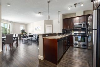 Photo 5: 3206 15 Sunset Square: Cochrane Apartment for sale : MLS®# A2120249